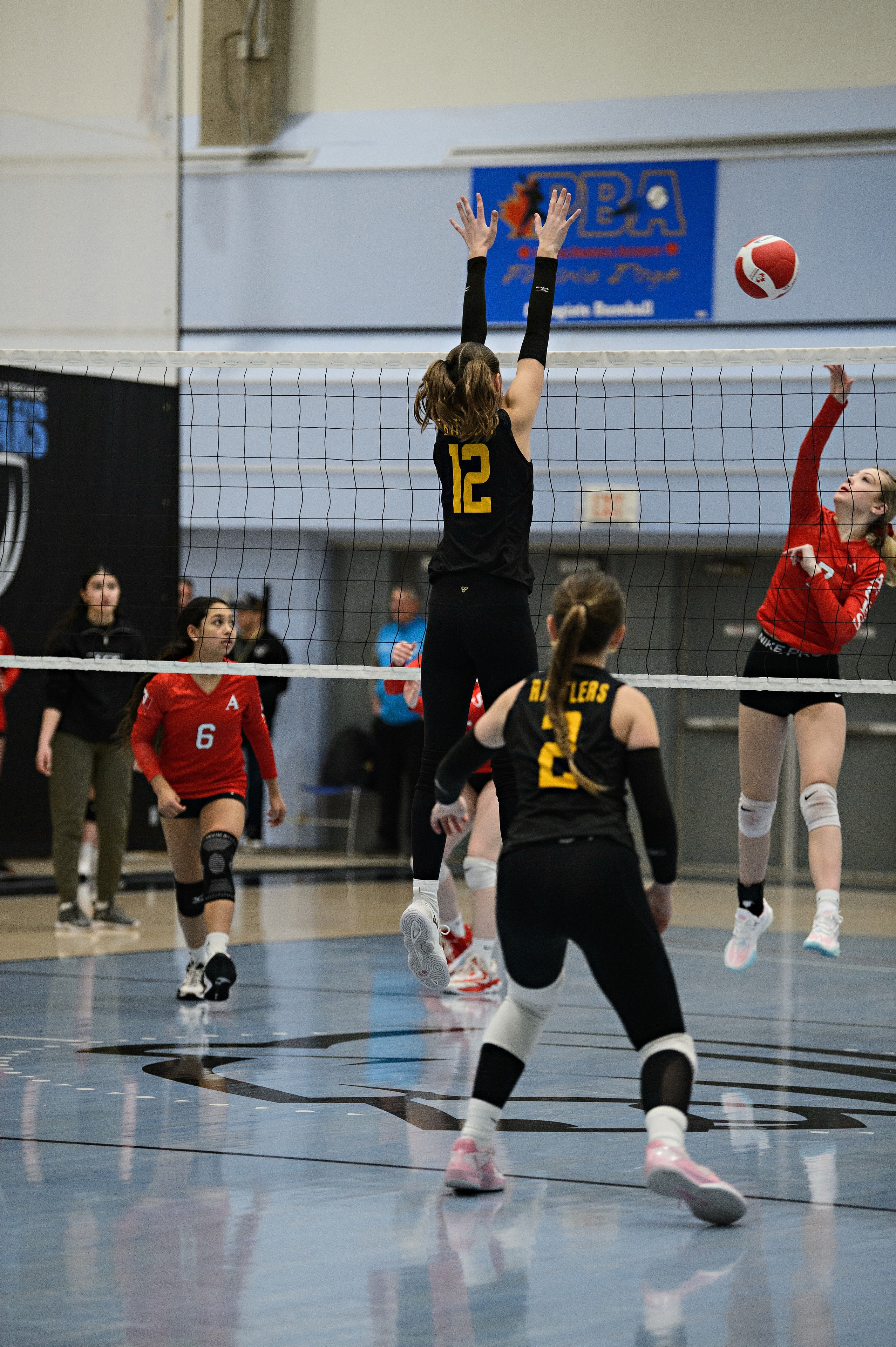 Rayna Bruins — block at the net, Rattlers
